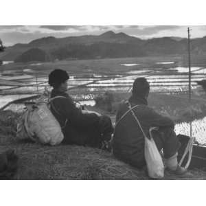  Repatriates Making Trek Home, Sitting on Knoll at Dusk to Look Out 