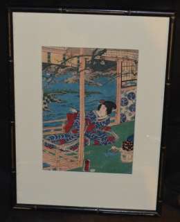 Japanese print of a Geisha that appears to be on silk or a silky typer 