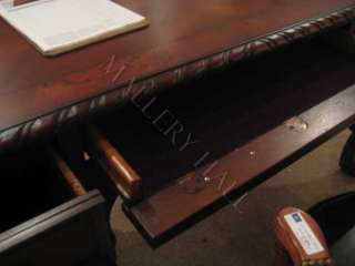 simple accent desk with a mahogany finish, cabriole leg design 
