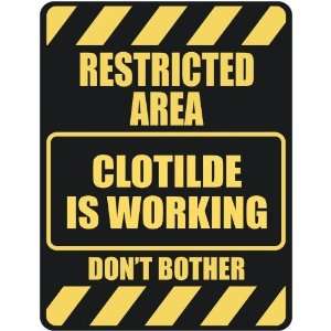   RESTRICTED AREA CLOTILDE IS WORKING  PARKING SIGN