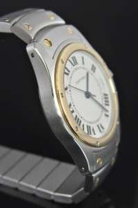 White dial with black Roman numerals Stainless steel Cartier 