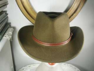 Up for sale is a dark olive greenish brown hat. On the inside it says 