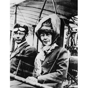   Martin with her son, Glenn L. Martin, in an early Martin plane. Martin