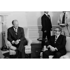 President Gerald Ford and Secretary of State Henry Kissinger, seated 